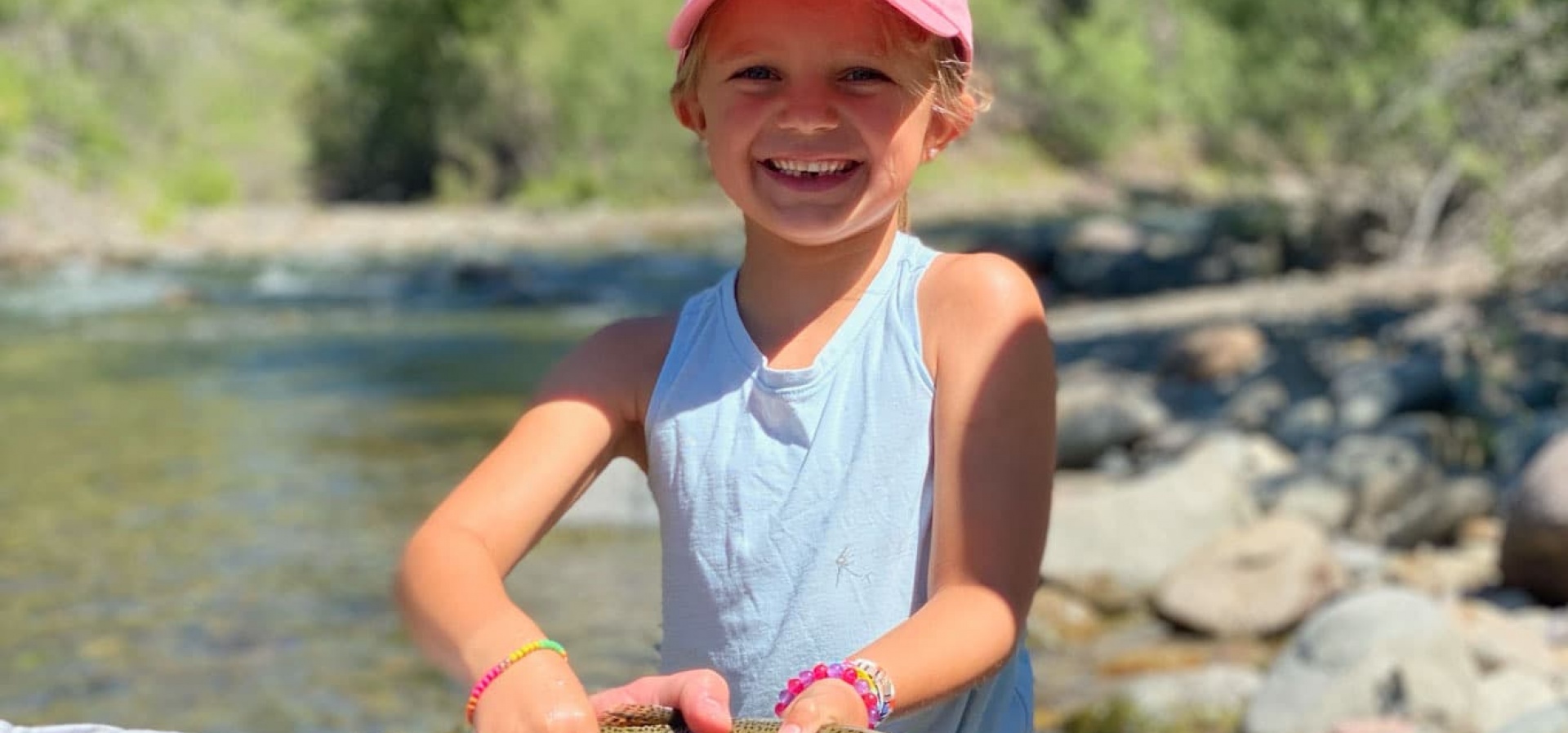 Girl catching fish on the big wood river