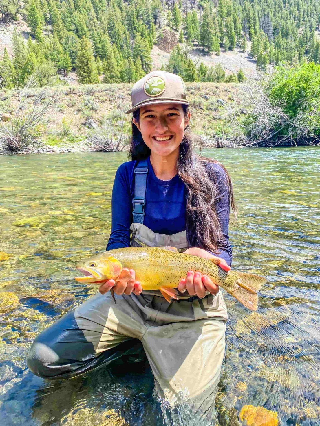 Female holds large fish on the Big Lost
